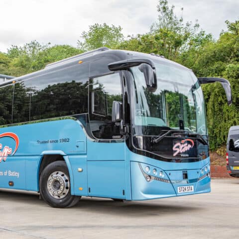 Star Coaches luxury bus close-up view - professional Leeds Festival transportation